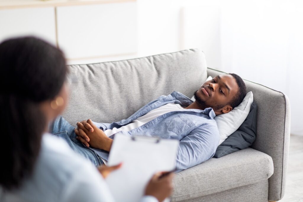 man lying on a couch